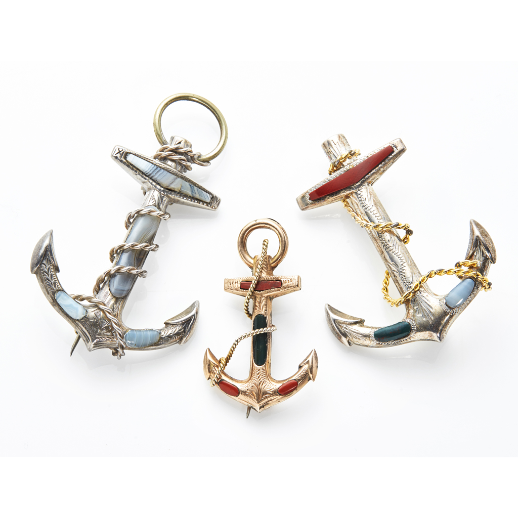 A collection of three 'anchor' brooches