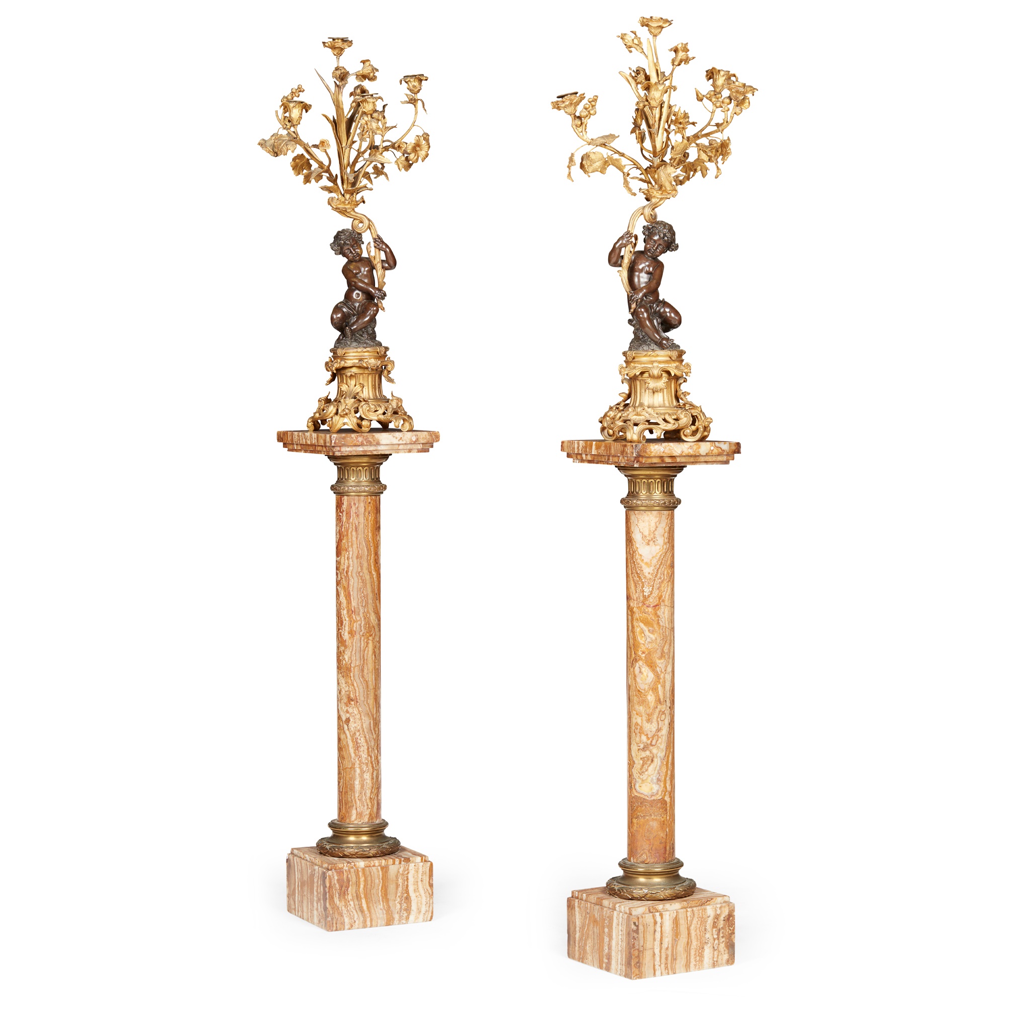PAIR OF FRENCH GILT AND PATINATED BRONZE FIGURAL CANDELABRA, WITH ASSOCIATED ONYX PEDESTALS