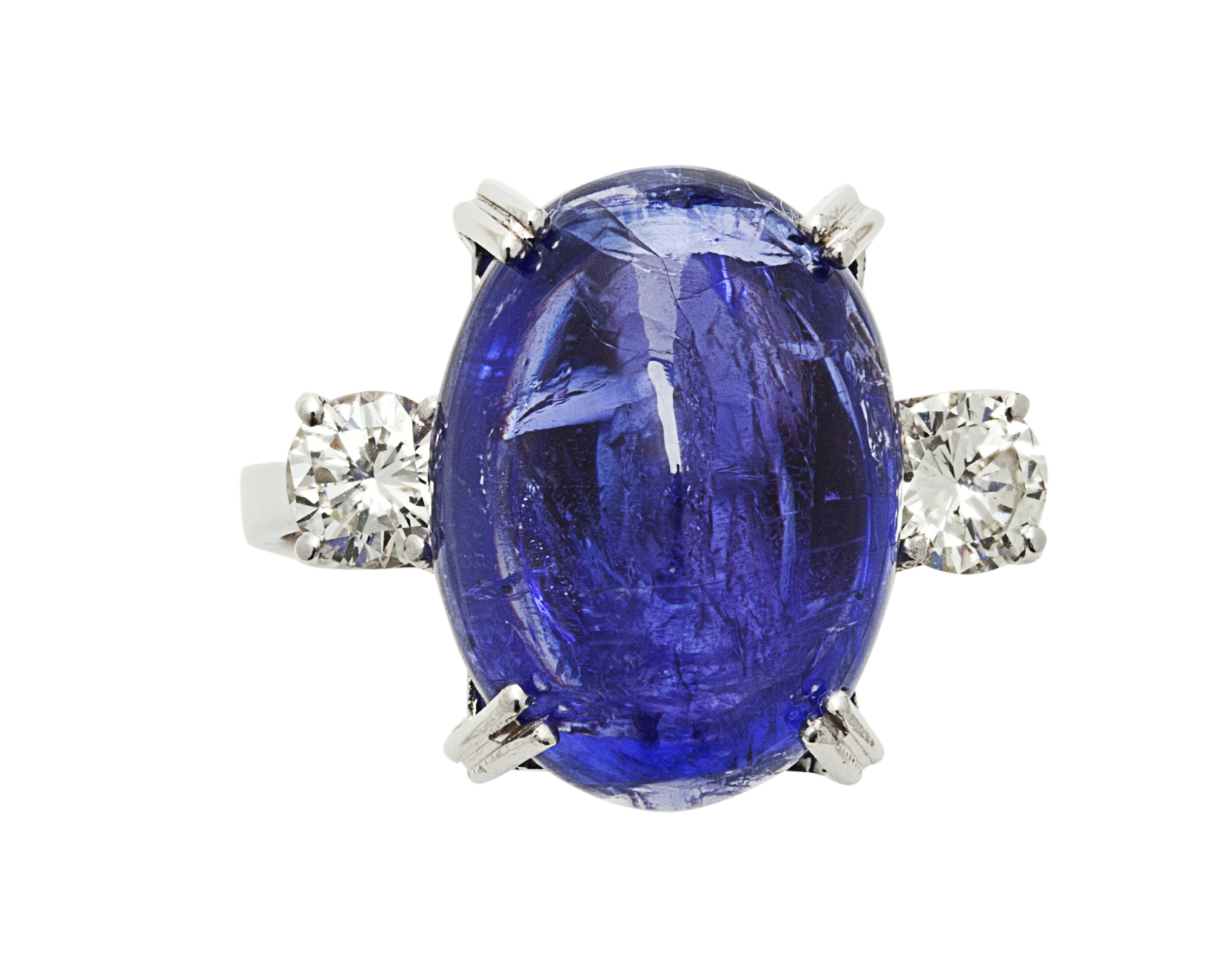 A cabochon Tanzanite and diamond set ring