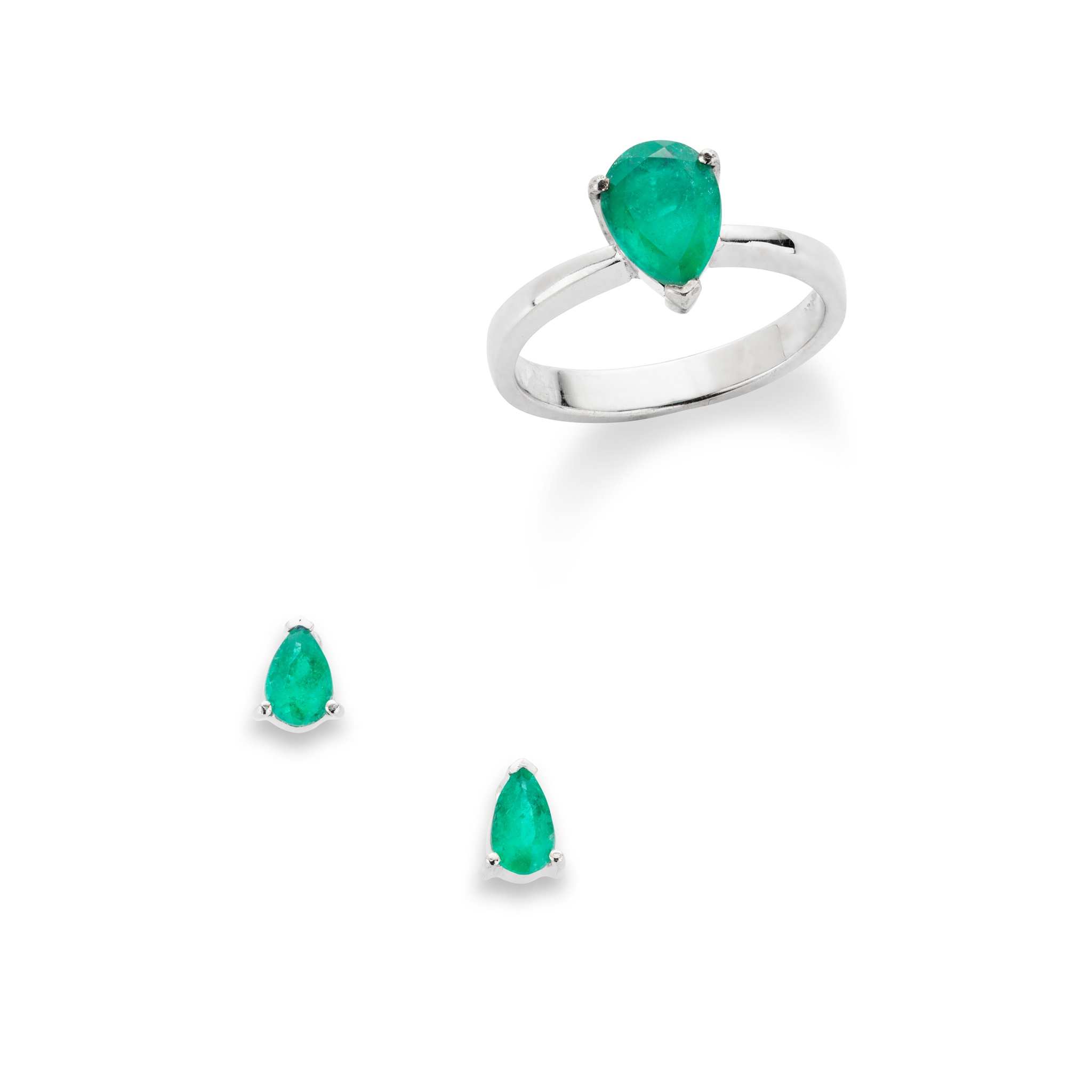 An emerald single-stone ring and pair of earrings