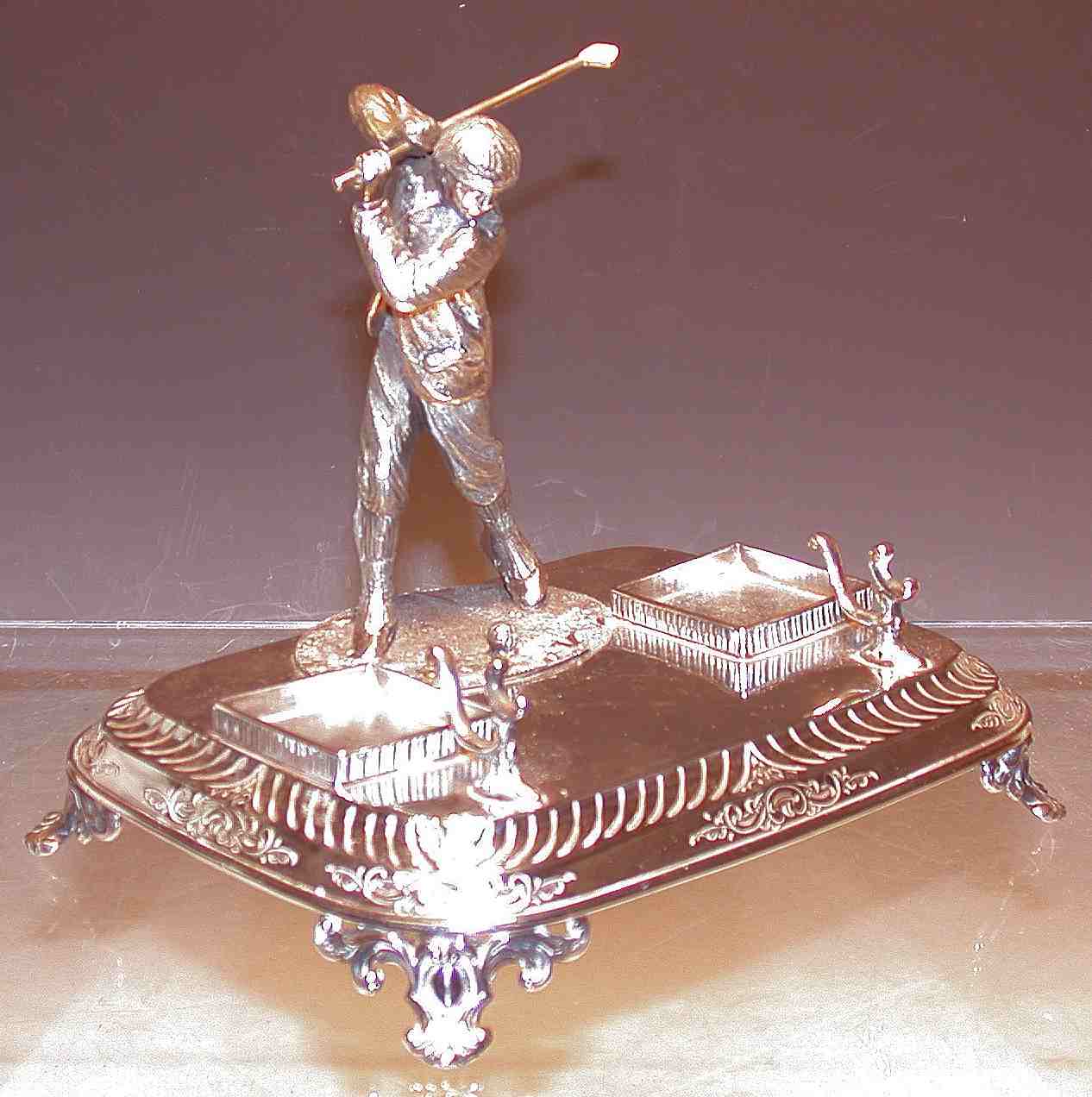 A silver plated golfing inkstand,