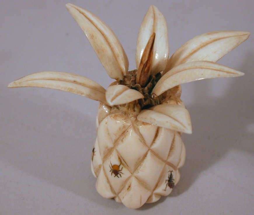 A small Japanese carved ivory shibyama decorated pineapple