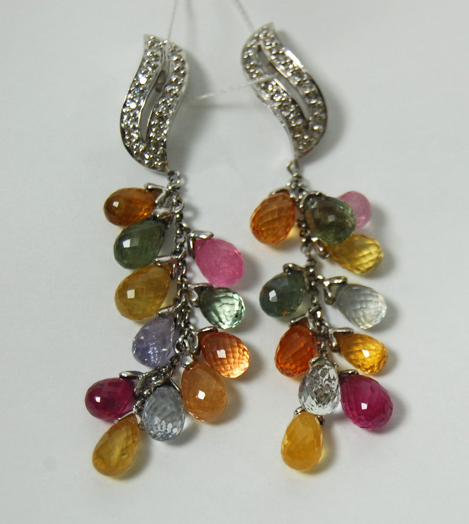 A pair of multi-gem set pendant earrings,