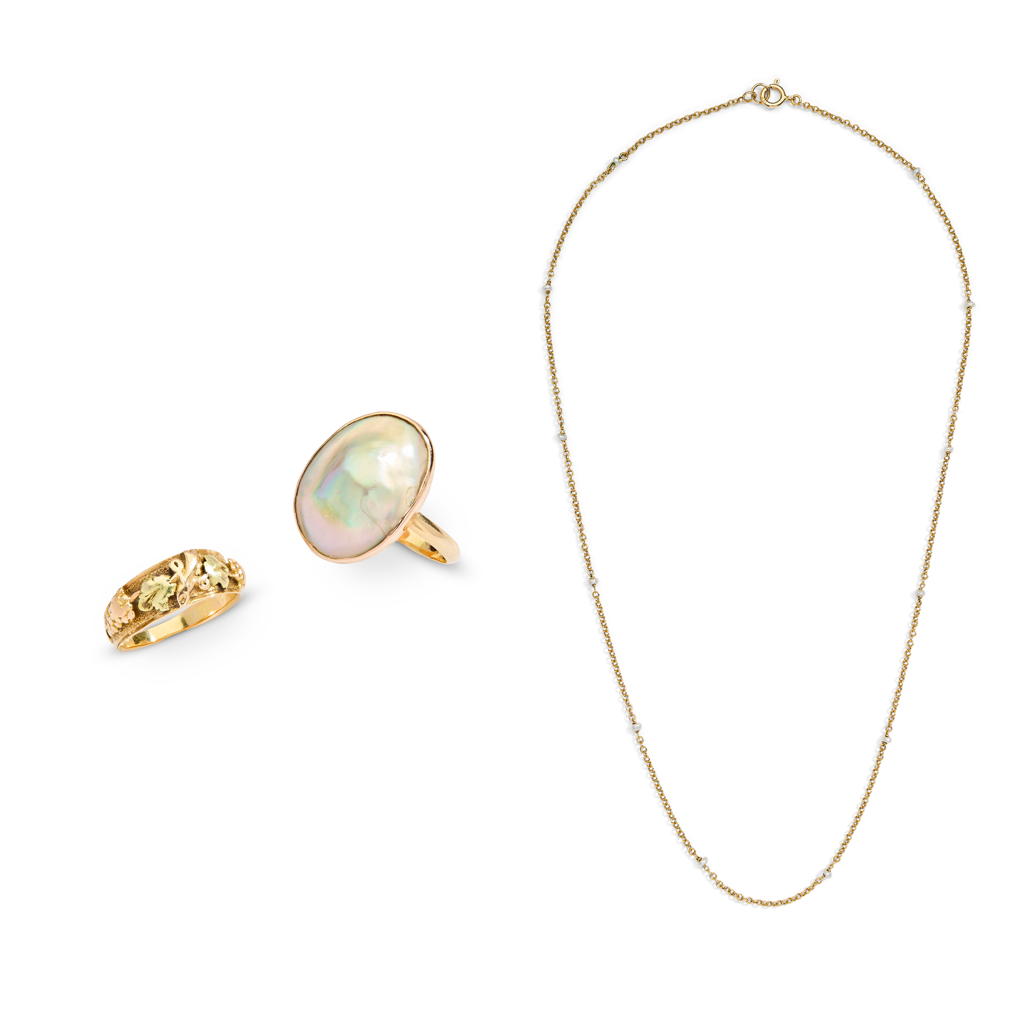 An early 20th century pearl necklet and two rings