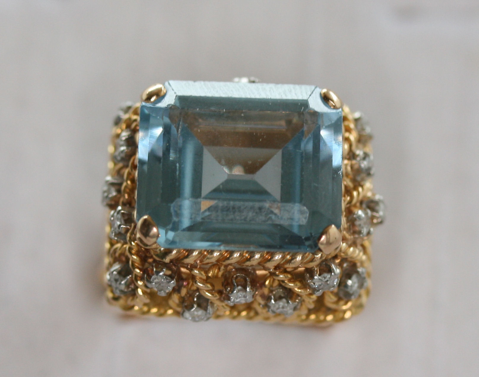 A large aquamarine and diamond cocktail ring