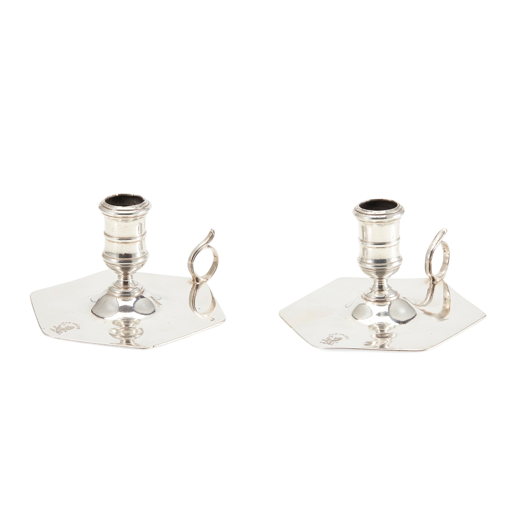 A SCARCE PAIR OF GEORGE III CHAMBERSTICKS