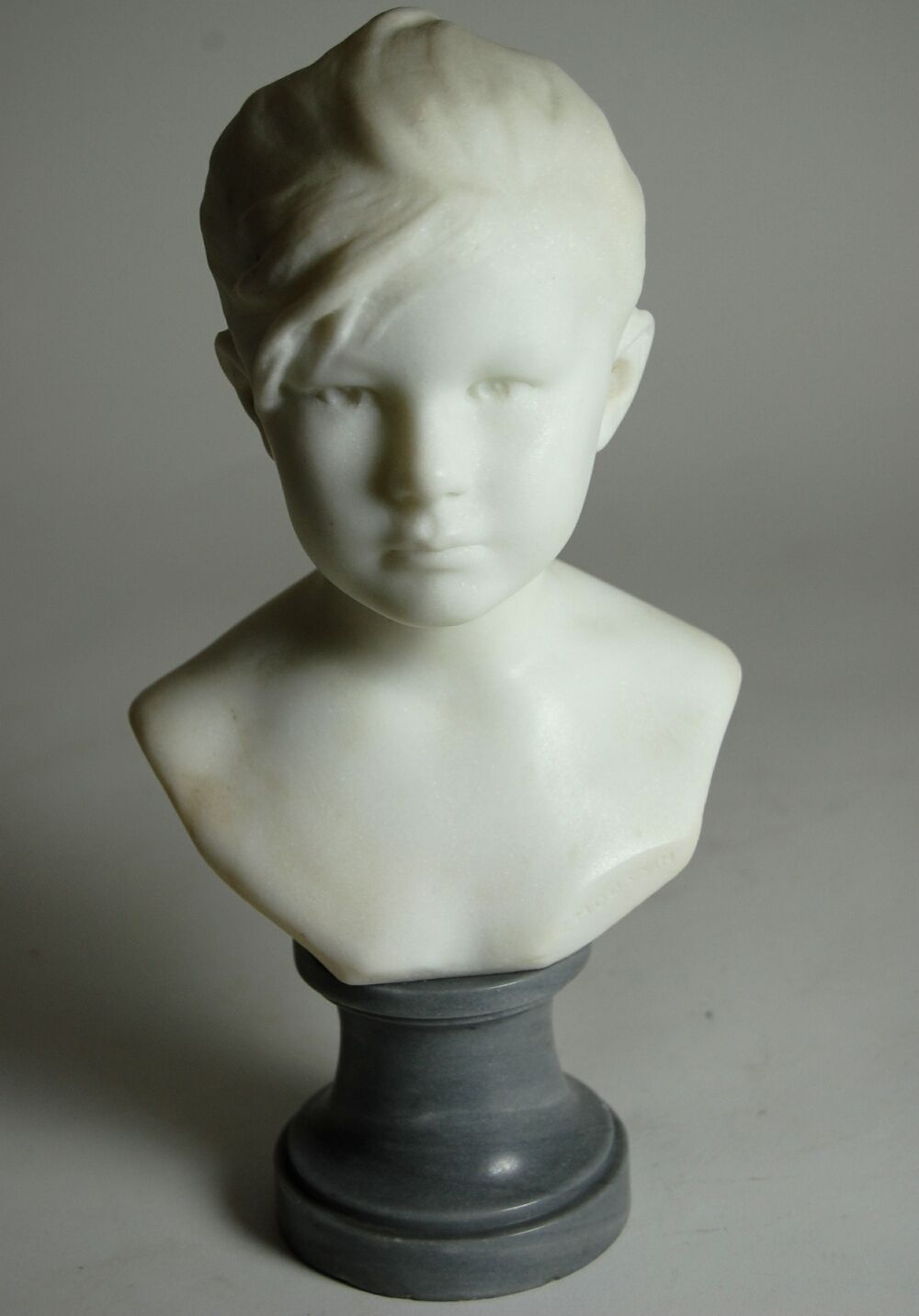 A marble bust of Louise By Edouard Charles Marie Houssin (1847-1917)