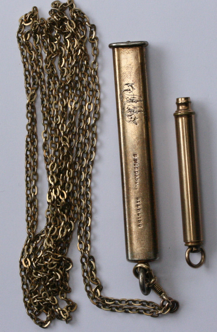A 9ct gold propelling pencil and chain