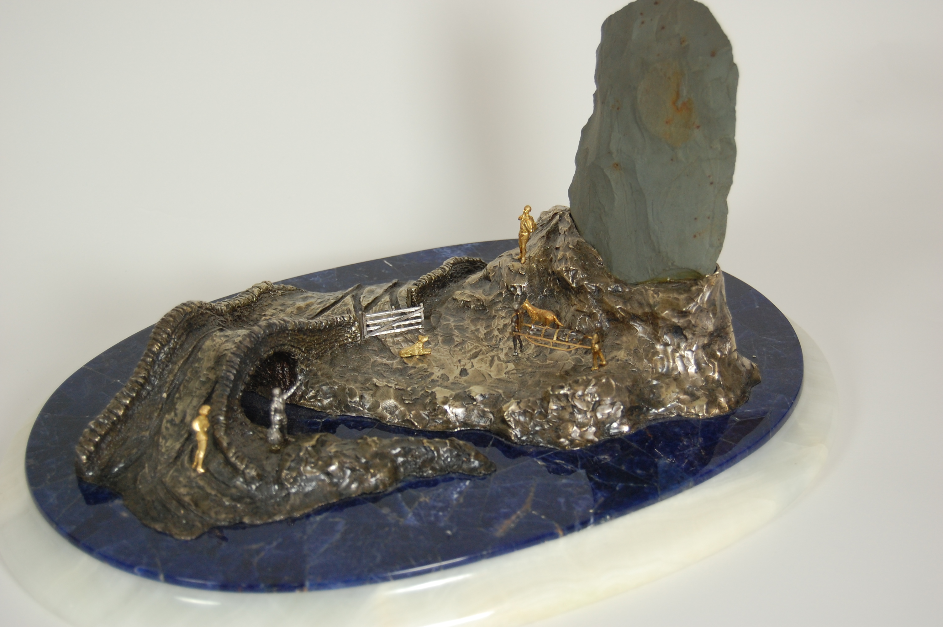 MOUNTAINEERING INTEREST; An unusual natural Scottish stone and silver centrepiece