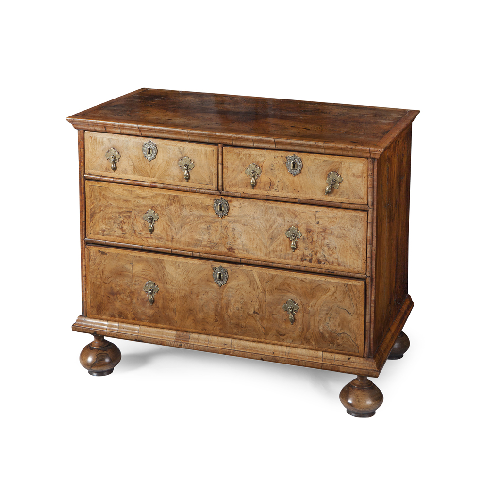 A WILLIAM AND MARY BURR WALNUT AND FEATHERBANDED CHEST OF DRAWERS