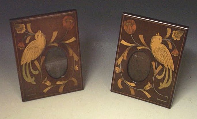 A pair of inlaid mahogany photograph frames,