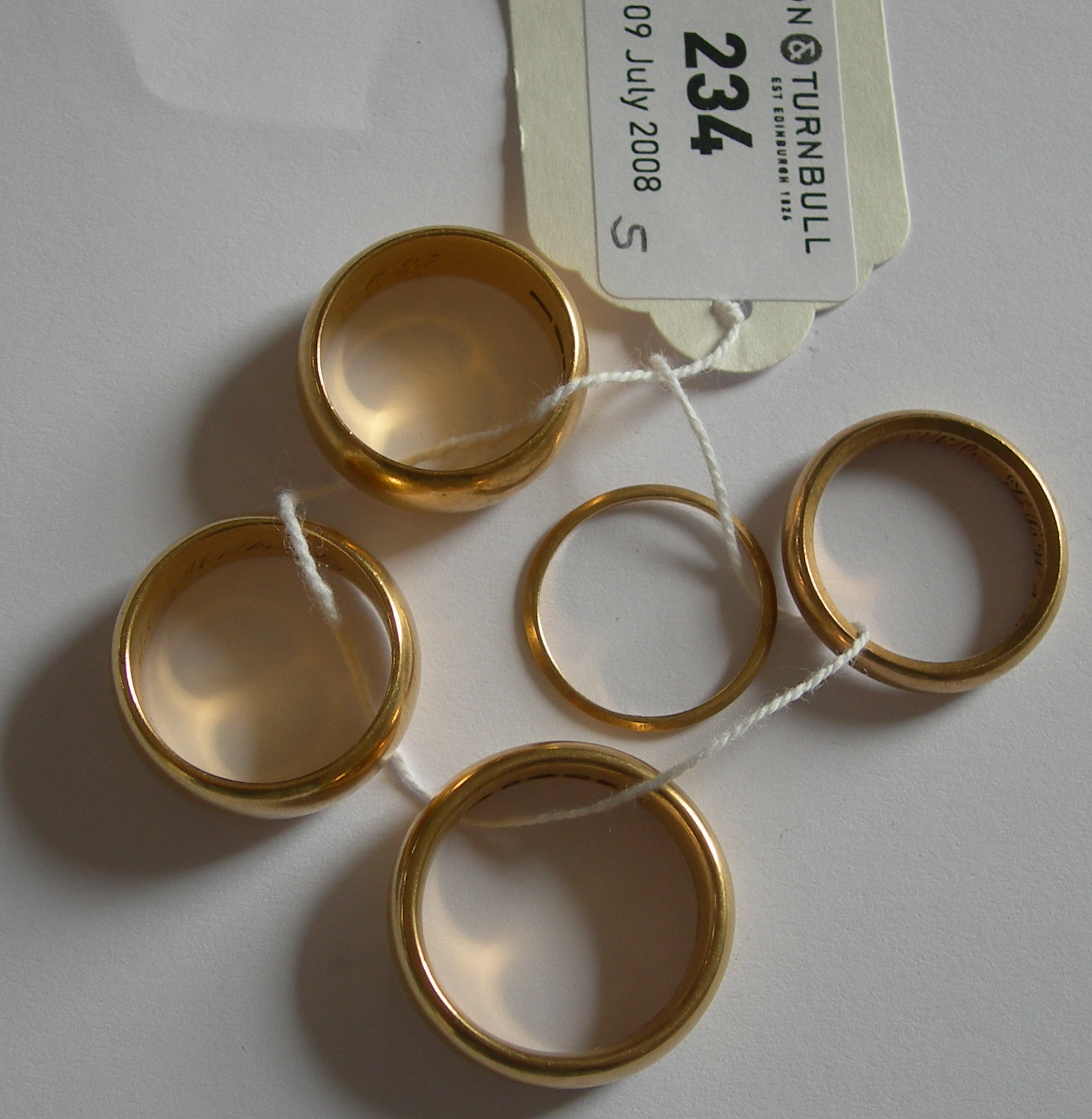 Five assorted wedding bands,