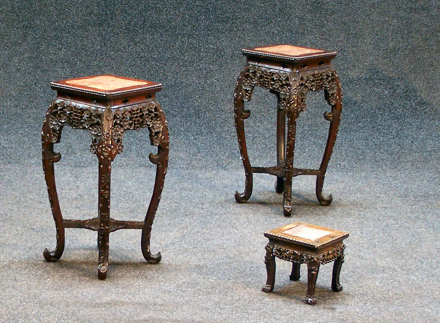 A pair of Chinese hardwood jardiniere stands,