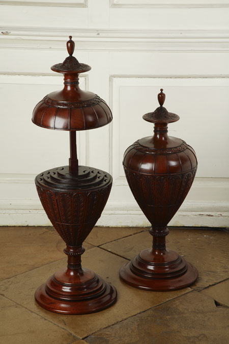 A pair of mahogany cutlery urns