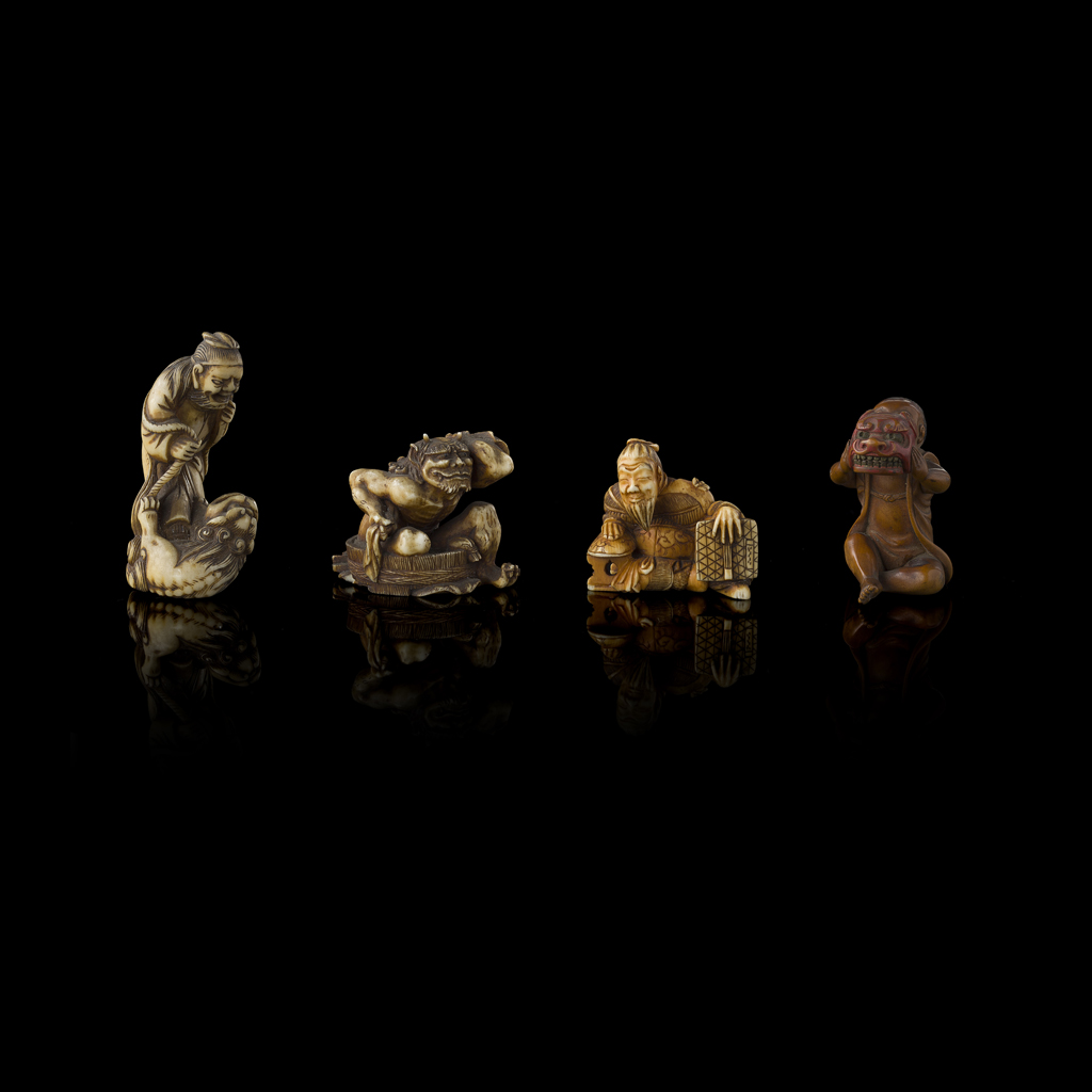 GROUP OF THREE IVORY AND A BOXWOOD NETSUKE