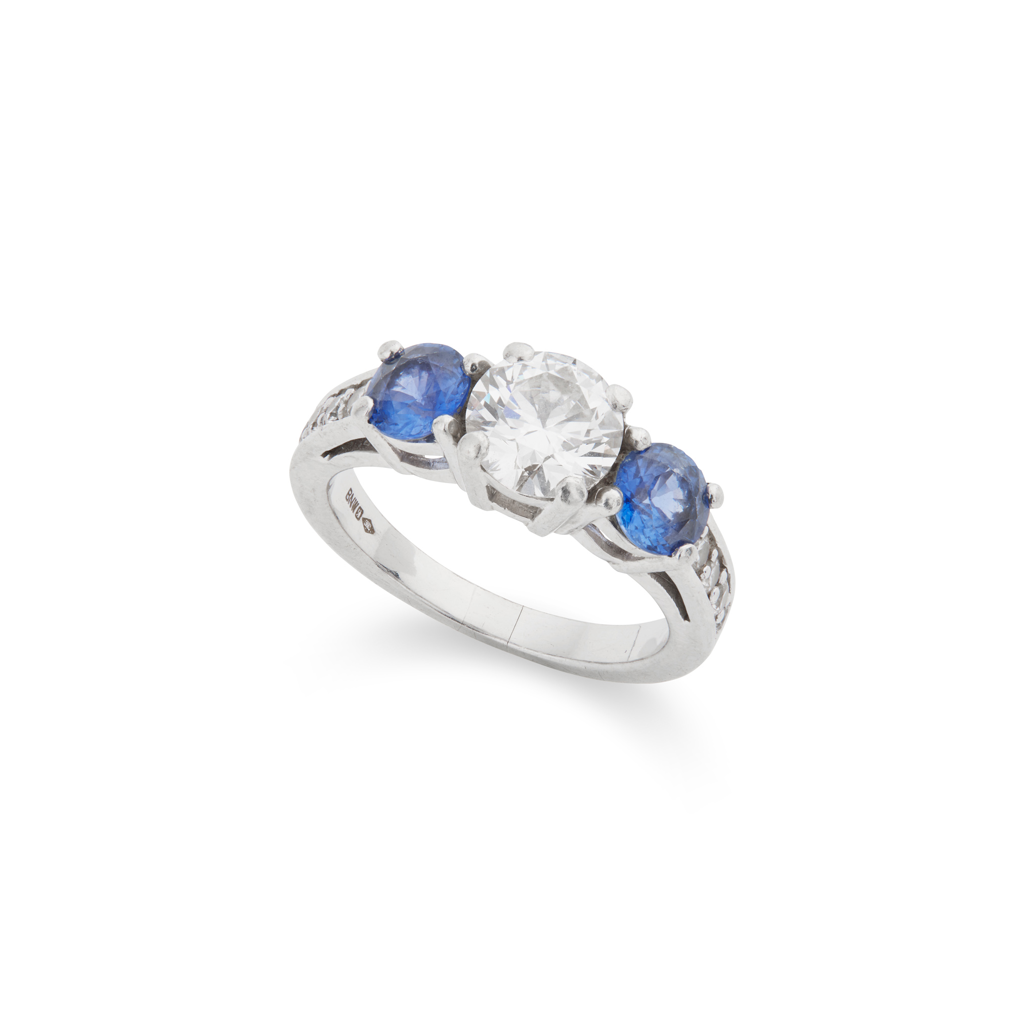 A sapphire and diamond three-stone ring