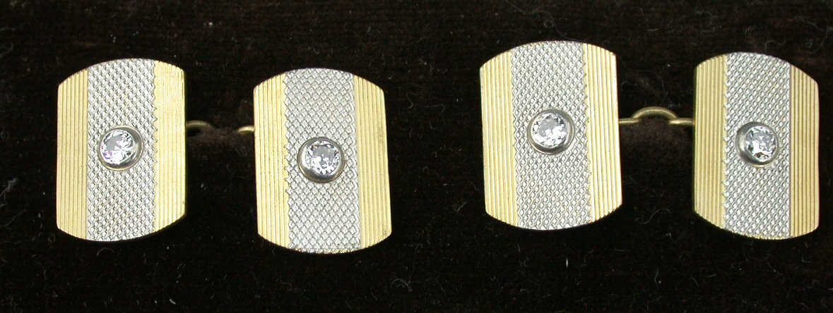 A pair of 18ct and platinum mounted diamond set cufflinks,