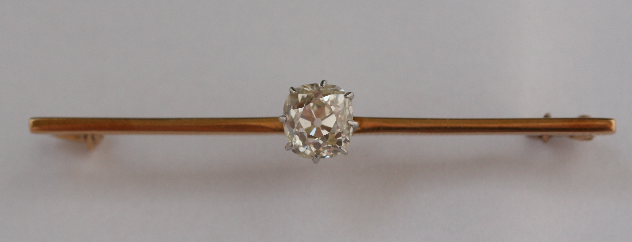 A diamond set bar brooch