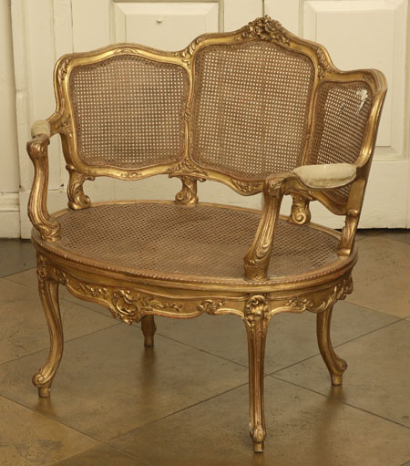 A French giltwood and caned bergere