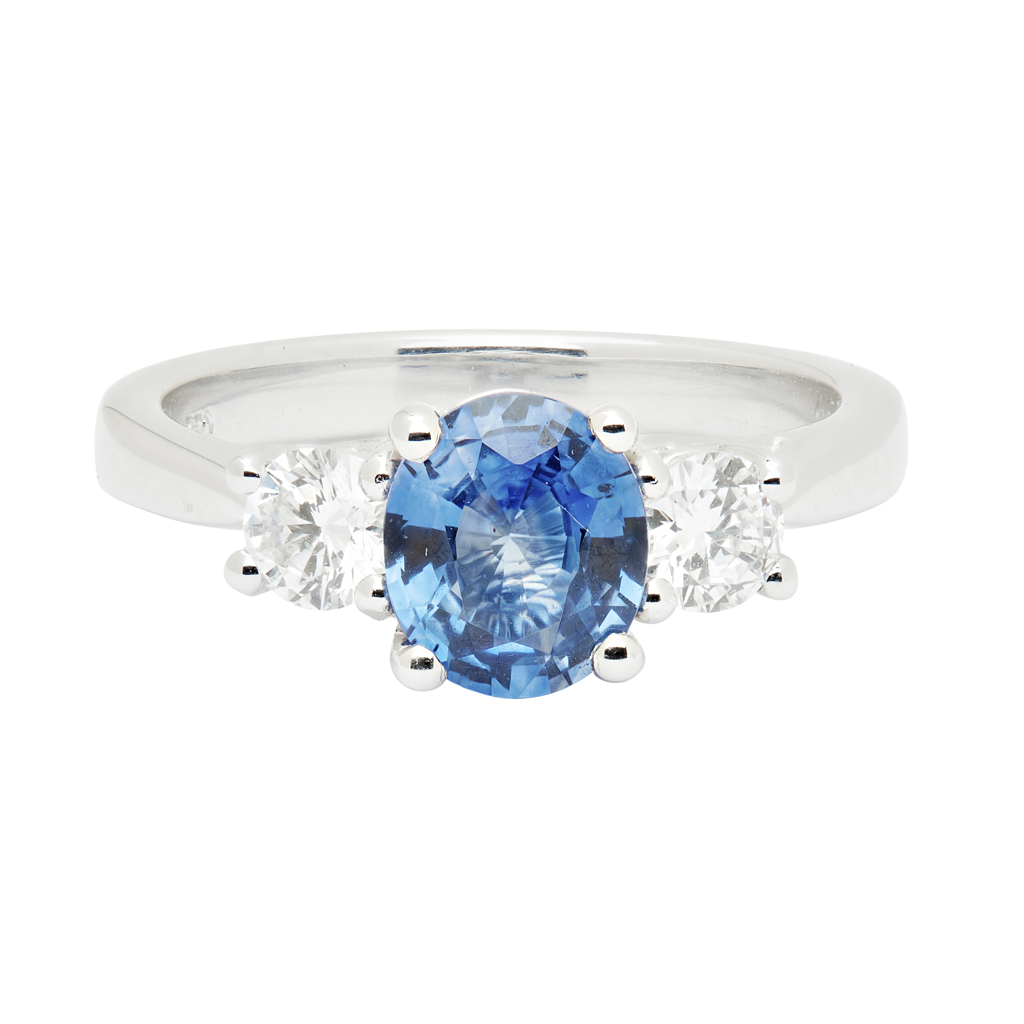 A three stone sapphire and diamond set ring