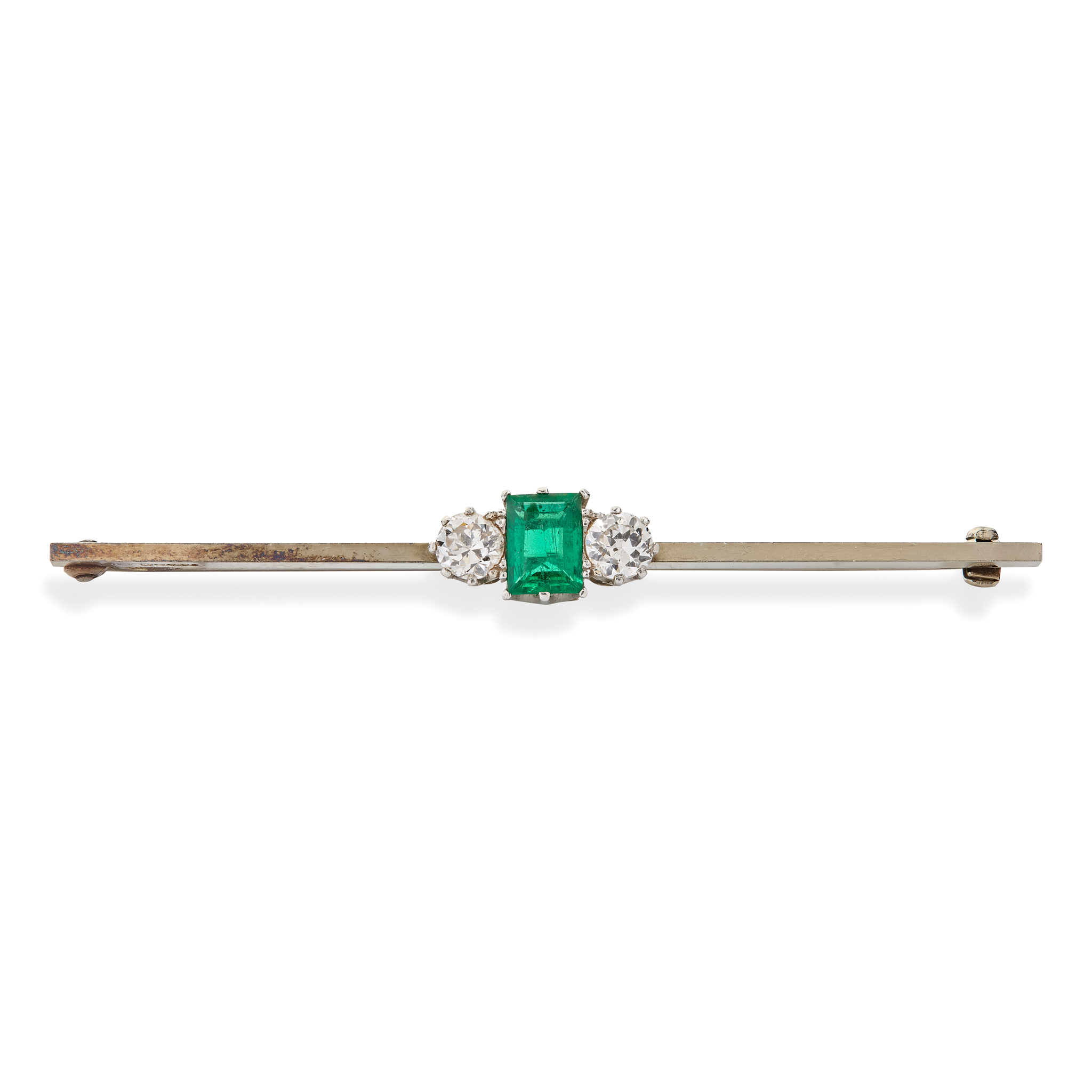 An emerald and diamond bar brooch