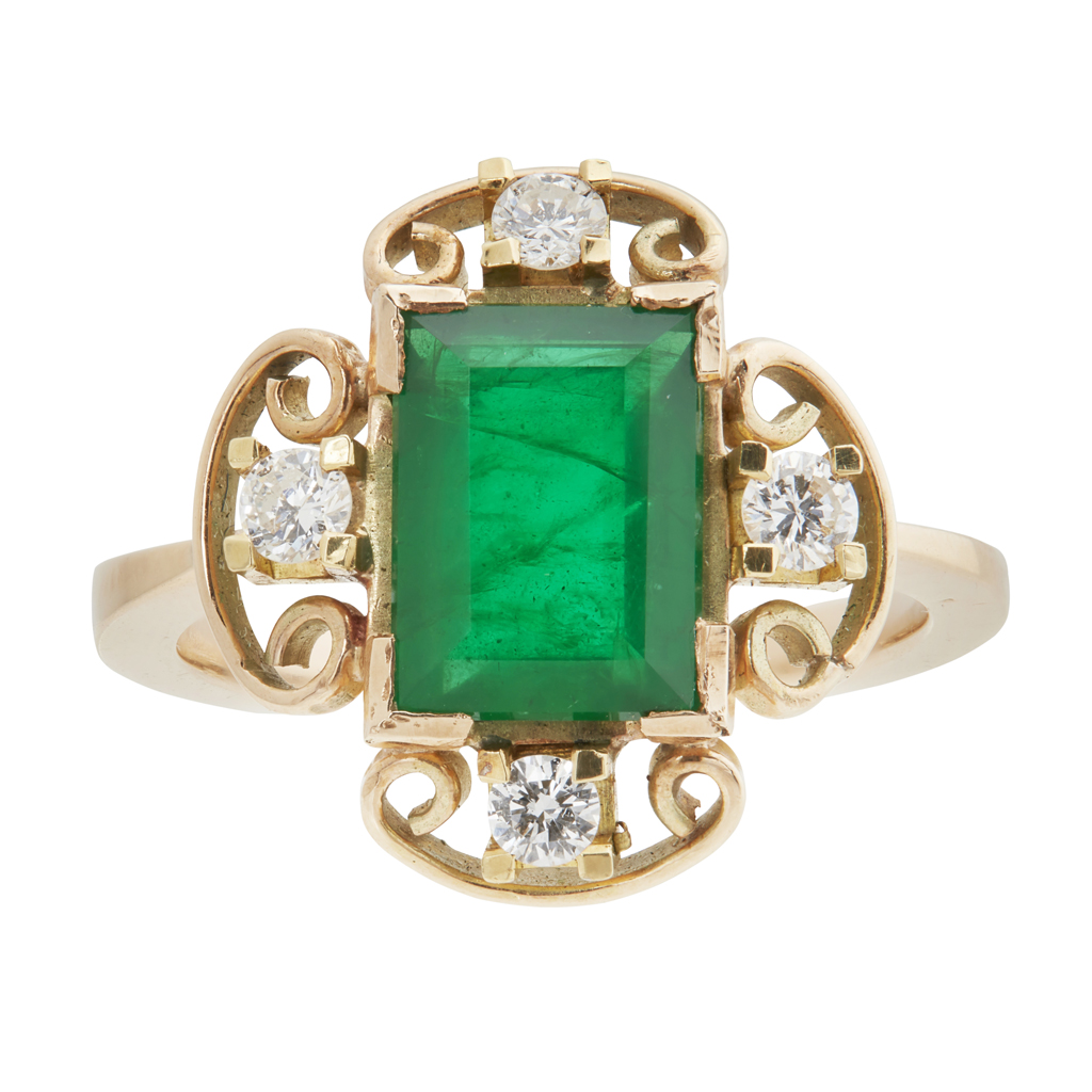 An emerald and diamond ring