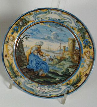 A small 18th century circular Castelli plate, dated 1733 Painted by Dr Francesco Antonio Grue