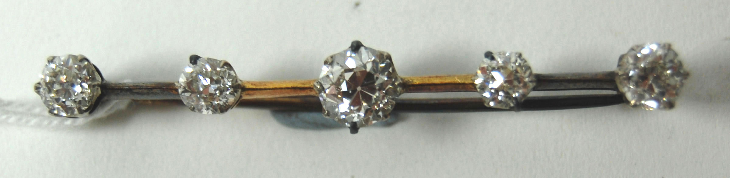 An early 20th century diamond set bar brooch,