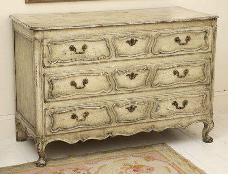 An early 19th century French provincial painted wood commode