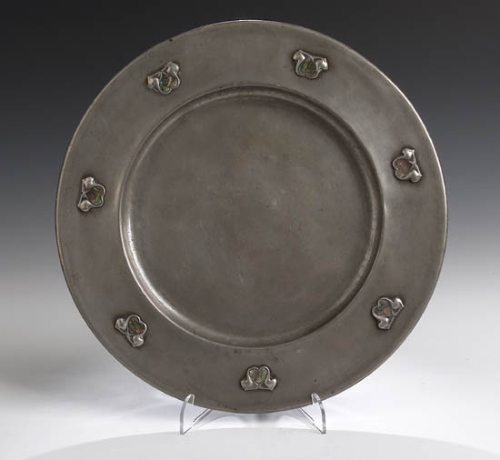 A Tudric circular pewter charger