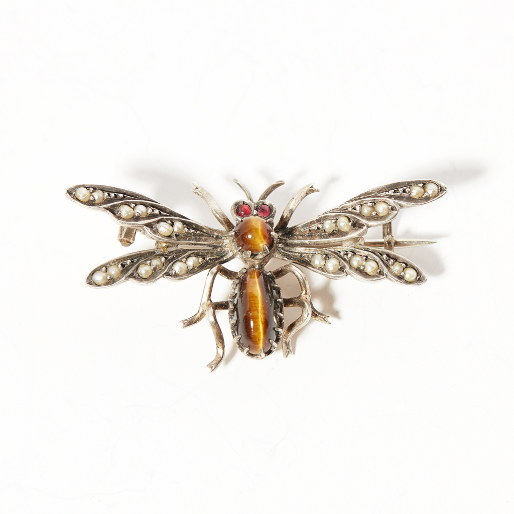 A gem set insect brooch