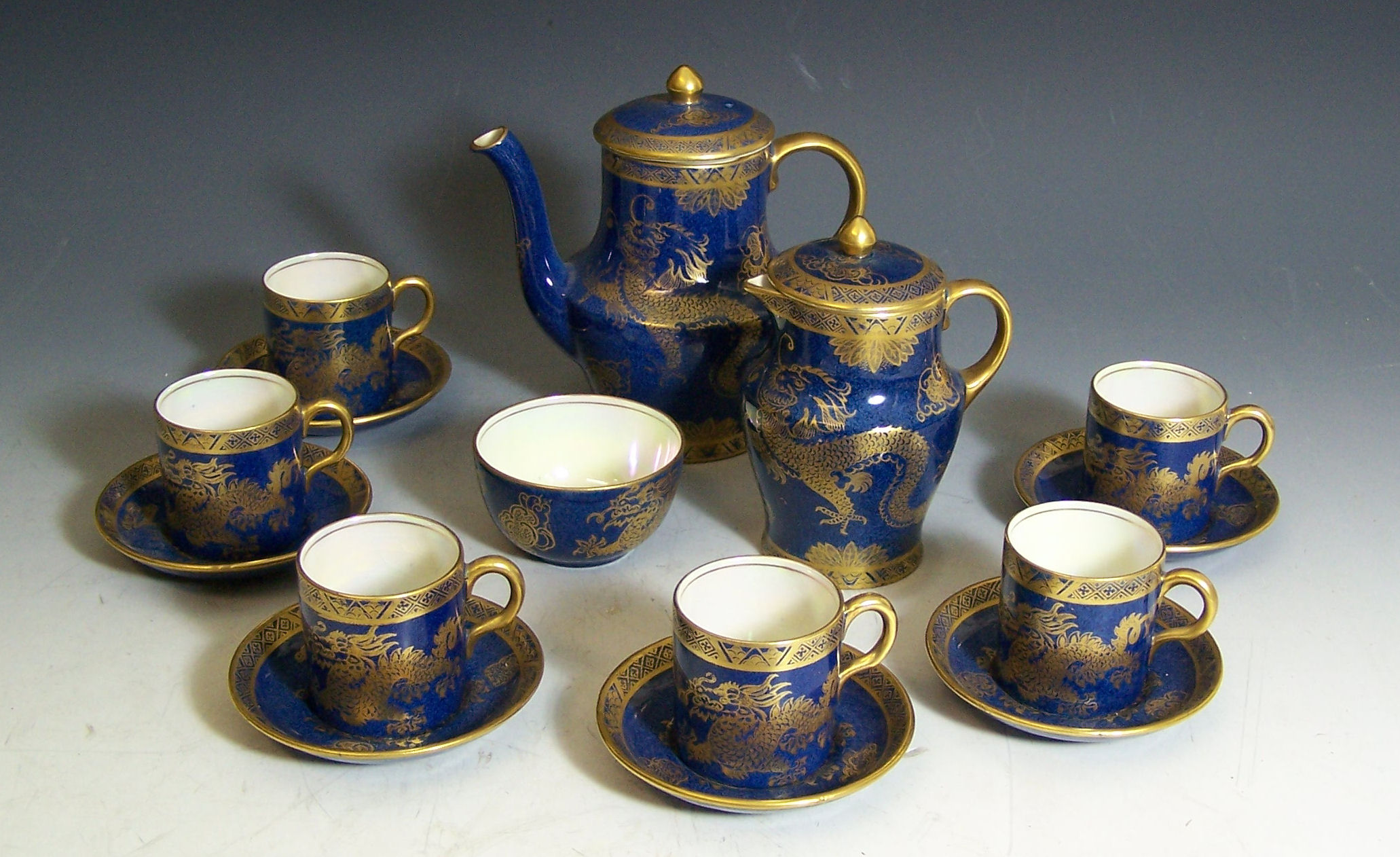 A Maling blue, gilt and lustre coffee service,