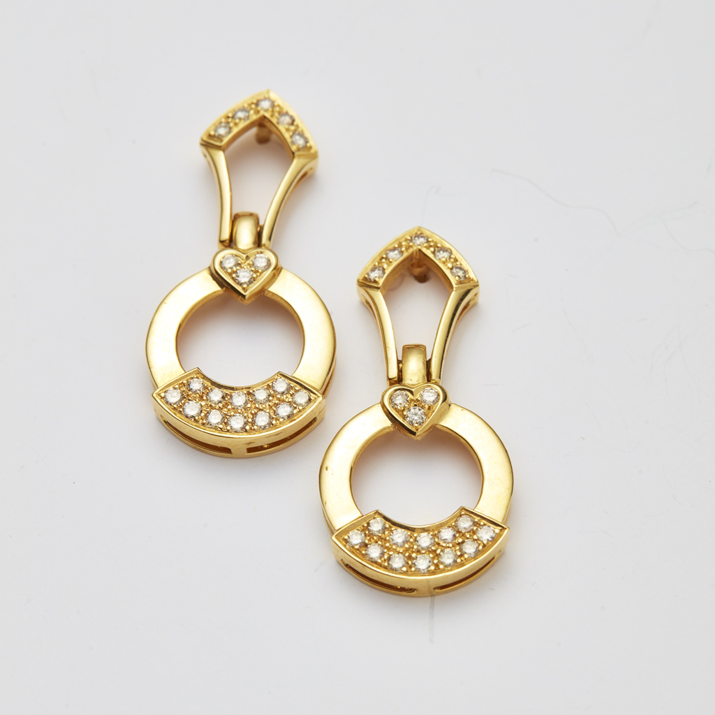 A pair of diamond set pendant earrings