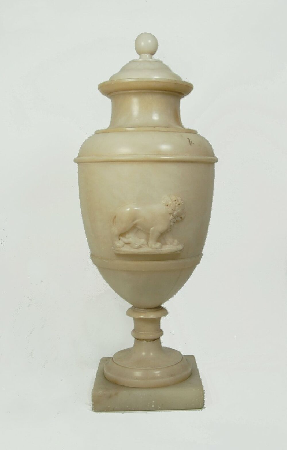 A Regency alabaster urn and cover after the Antique