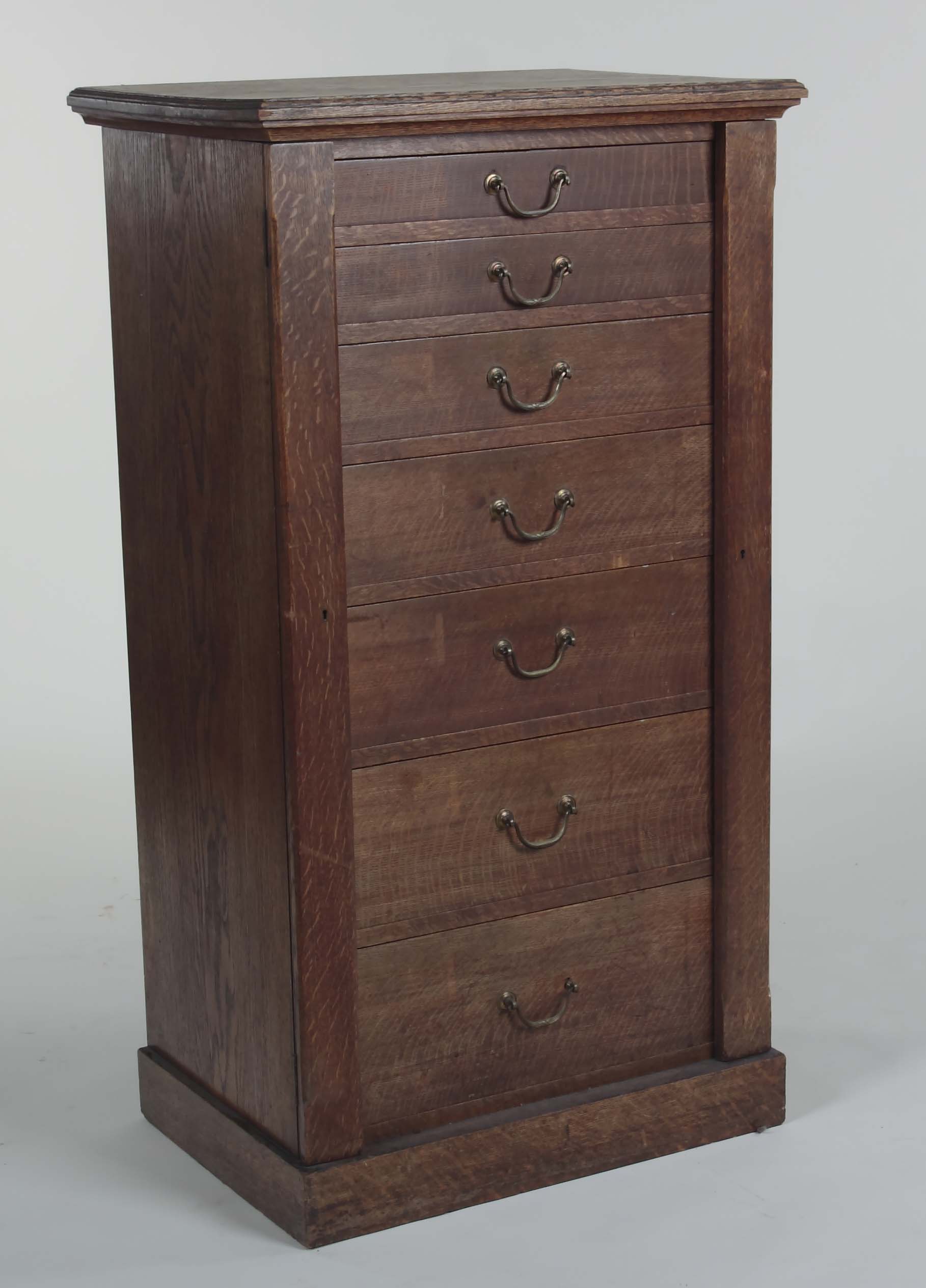 A late 19th/early 20th century oak Wellington chest