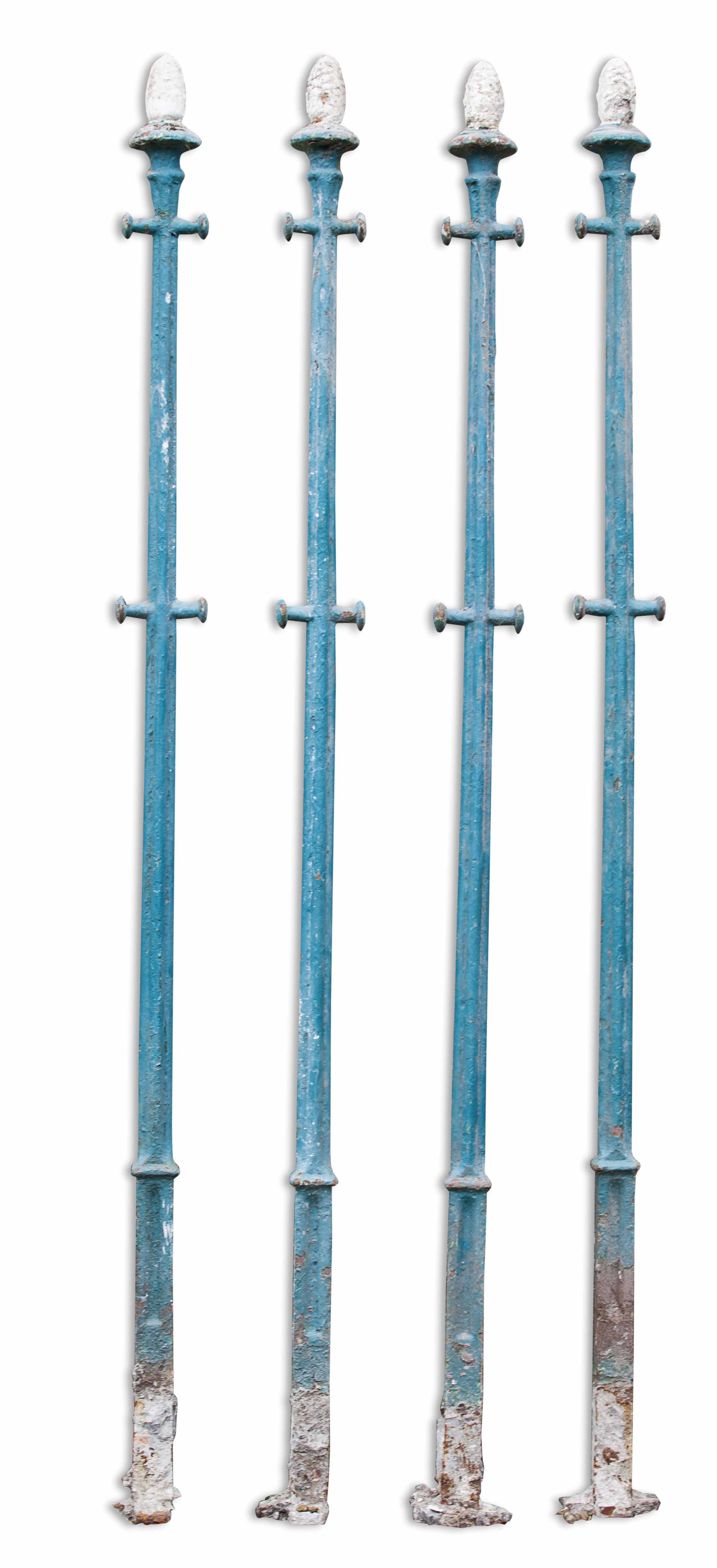 SET OF FOUR PAINTED CAST IRON LAUNDRY POSTS
