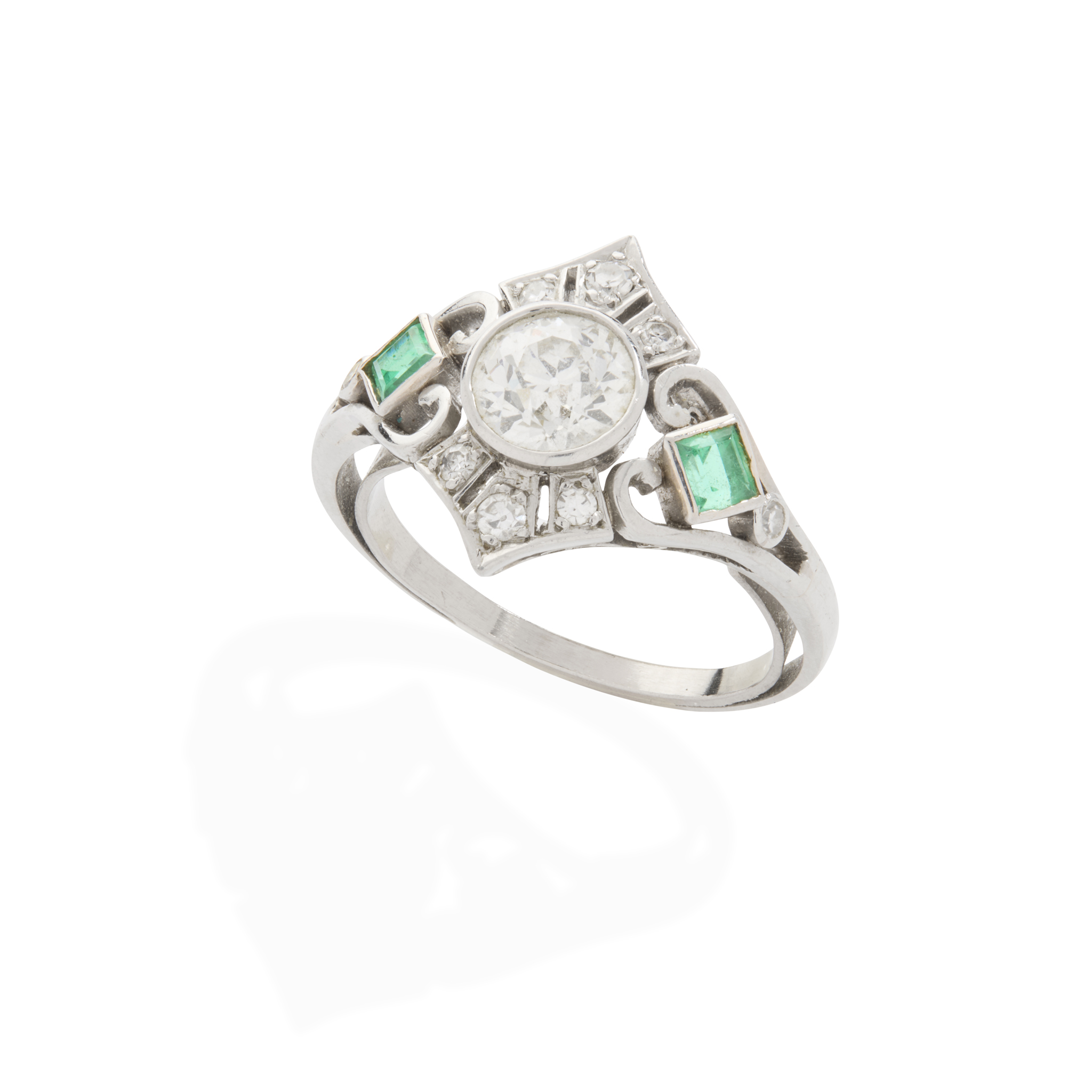 A diamond and emerald ring
