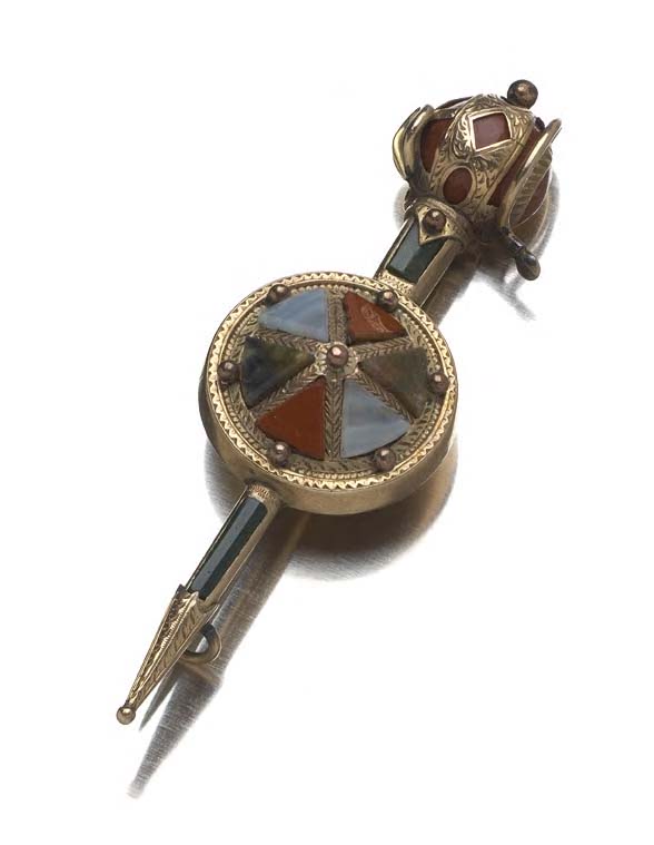 A gold mounted Scottish pebble brooch,