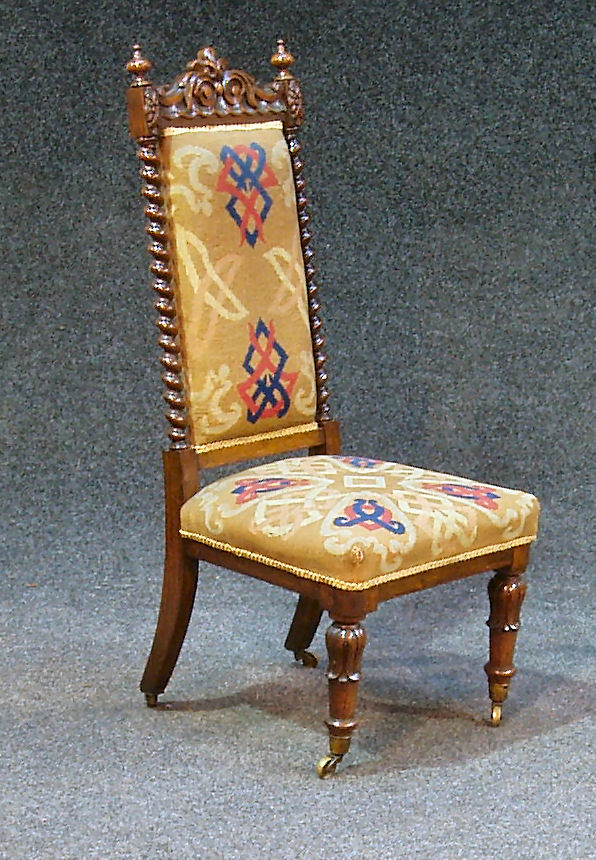 An early Victorian rosewood nursing chair,