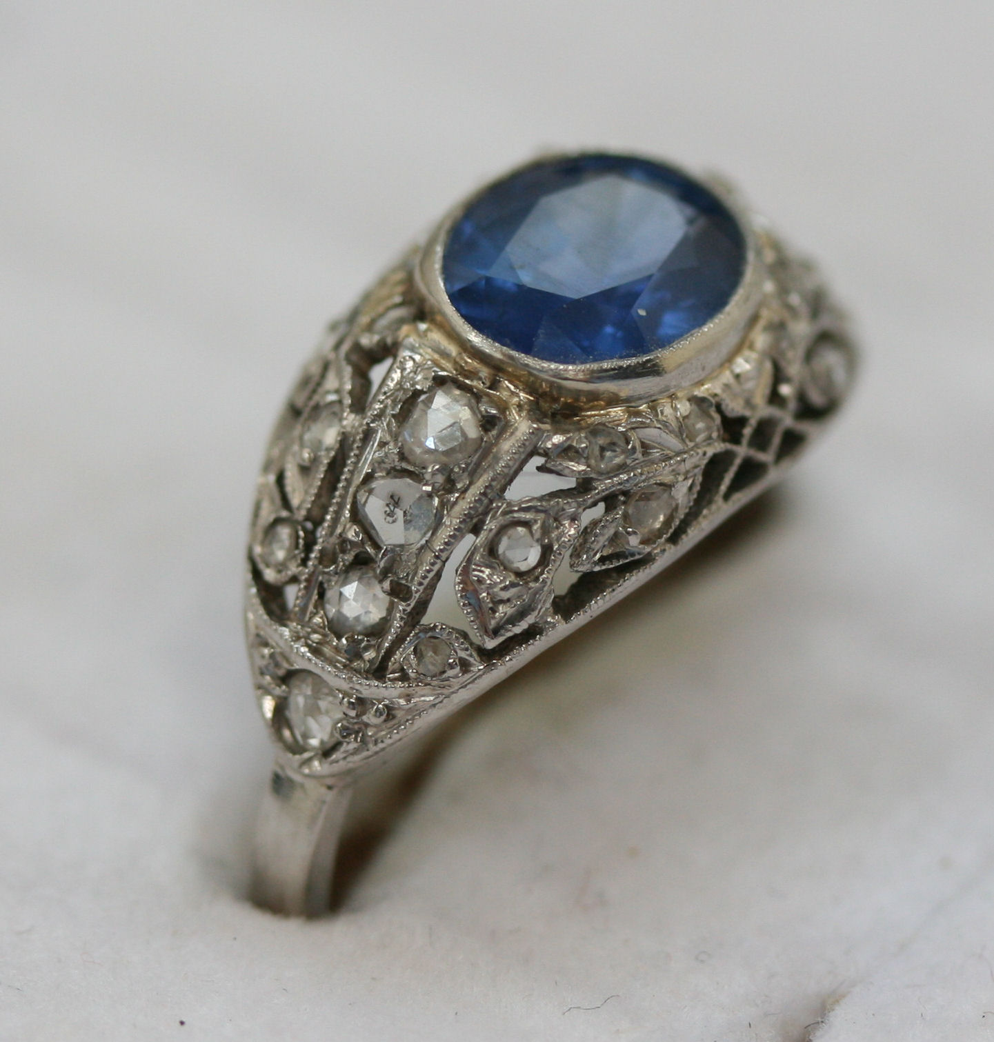 A French early 20th century platinum mounted sapphire and diamond set ring