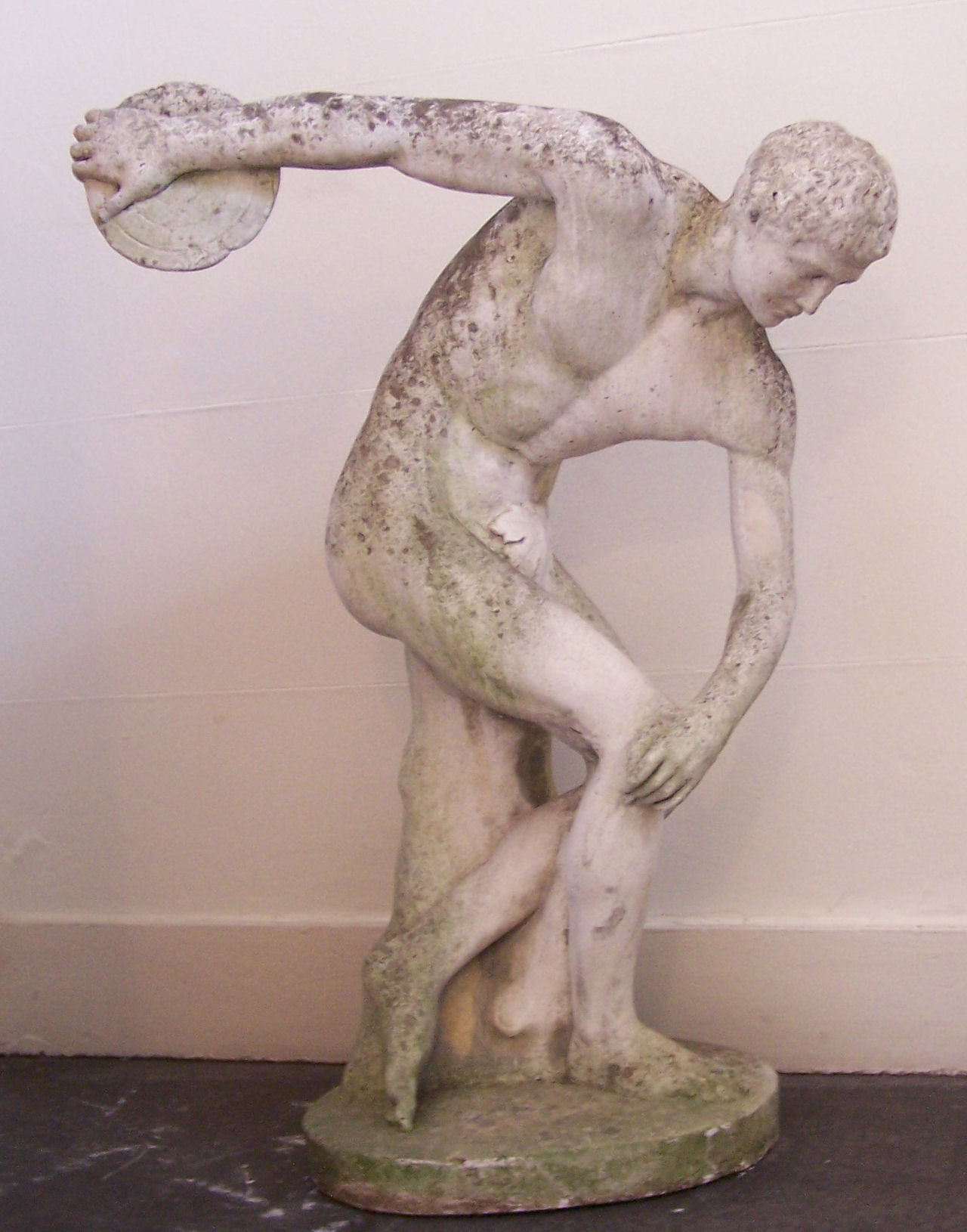 EXTRA LOT A composition garden statue of a discus thrower After the Antique