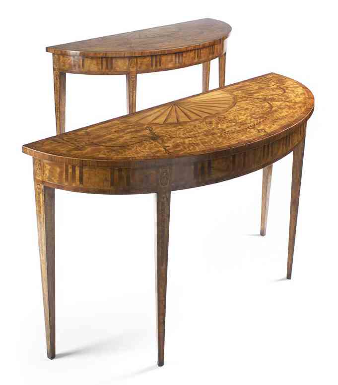 A pair of neo-classical satinwood and mahogany crossbanded demi-lune pier tables