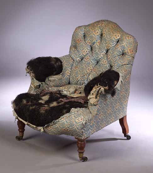 A Howard and Sons Victorian walnut framed armchair