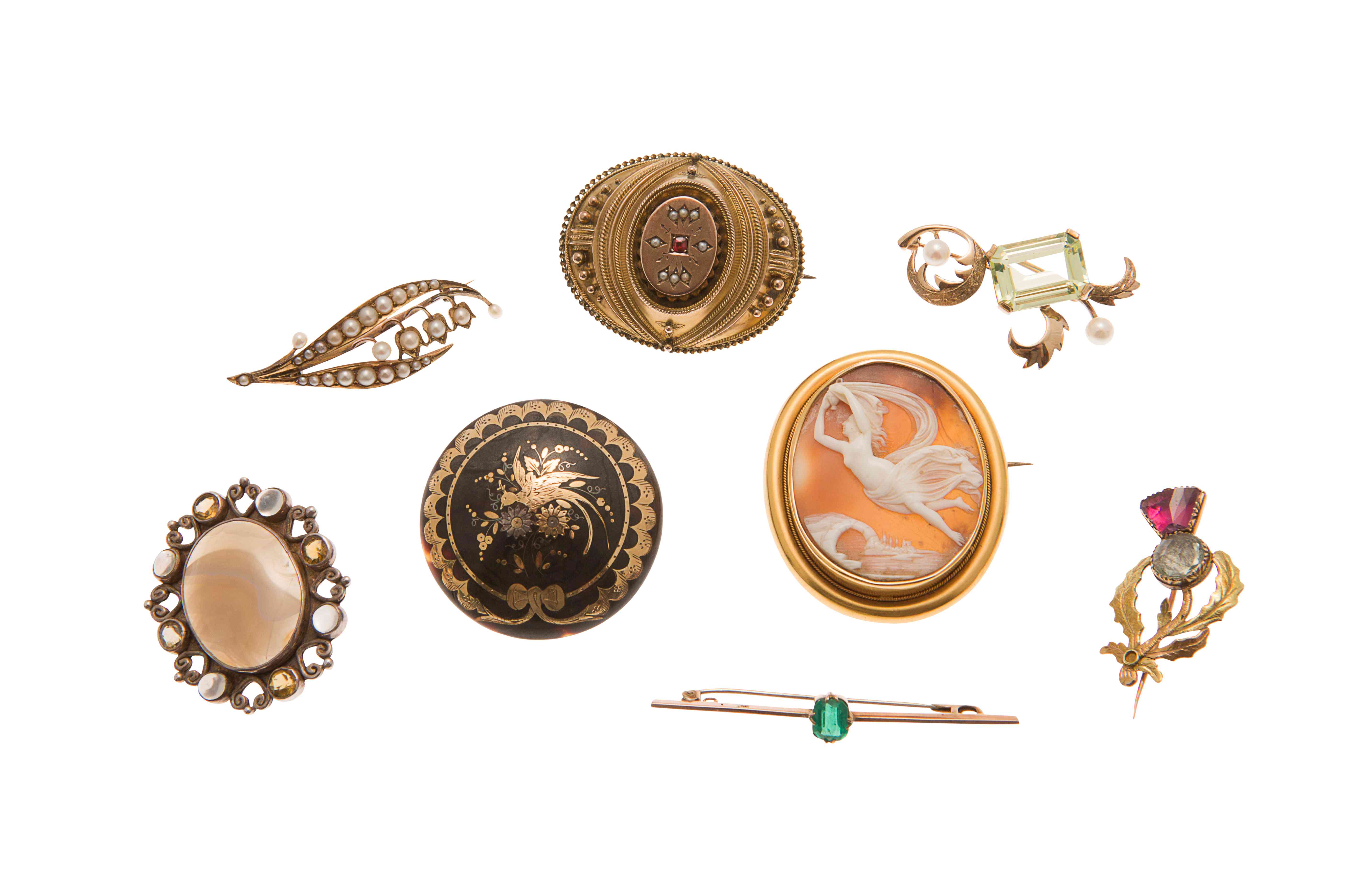 A collection of brooches