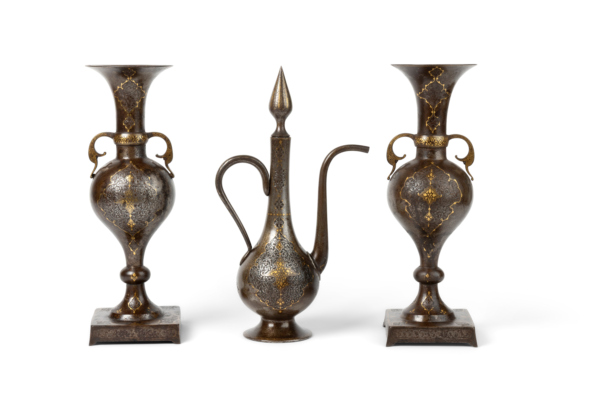 AN ELEGANT MATCHING SET OF QAJAR GOLD DAMASCENED STEEL VASES AND ONE EWER