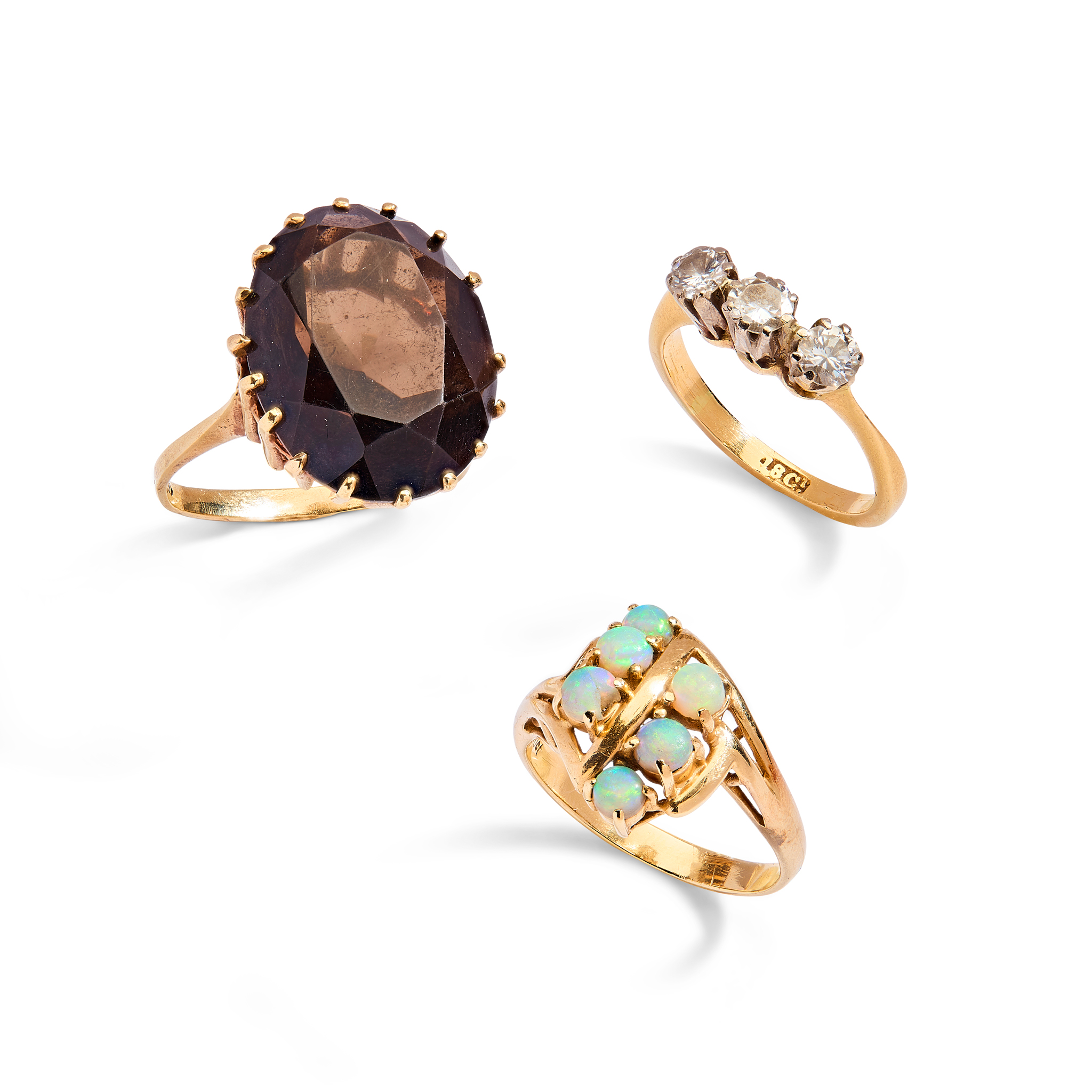 A collection of three gem-set rings