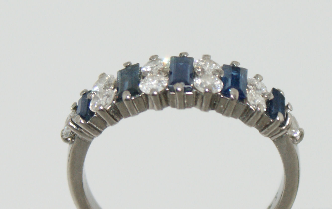 An 18ct white gold mounted sapphire and diamond set ring