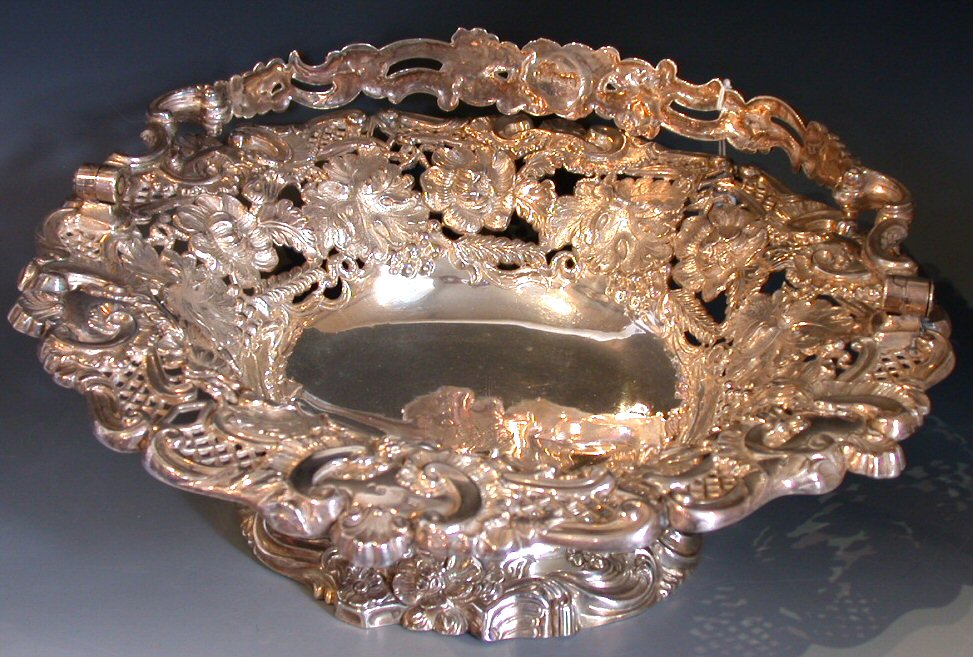 A George III swing handled cake basket,