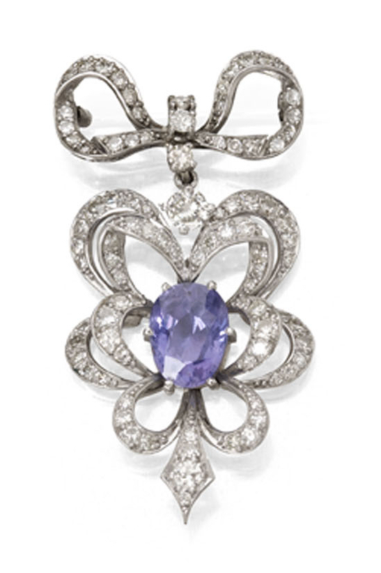 A violet sapphire and diamond set brooch,