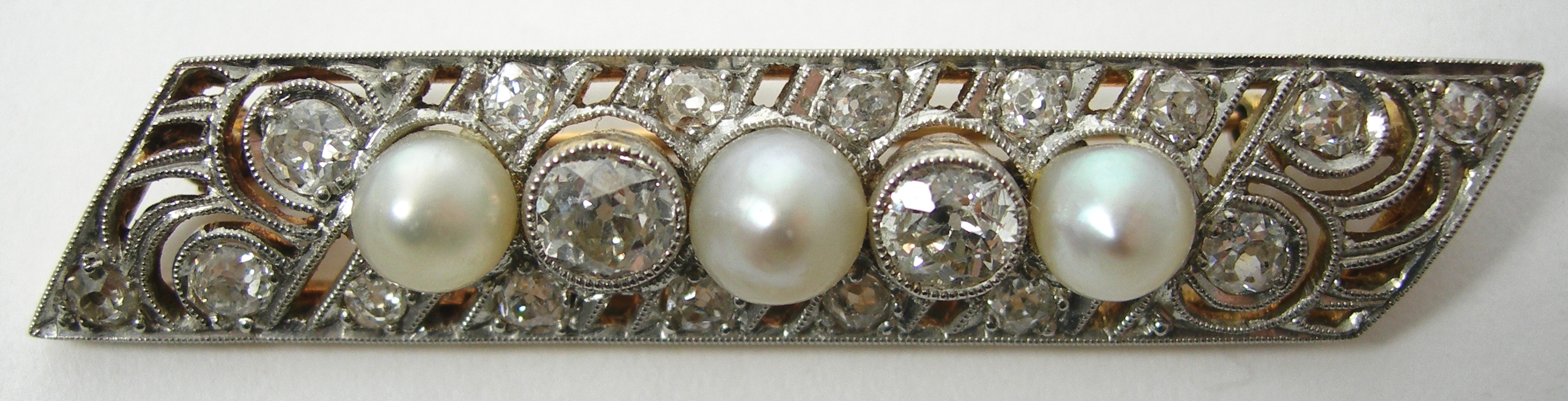An early 20th century cultured pearl and diamond brooch,